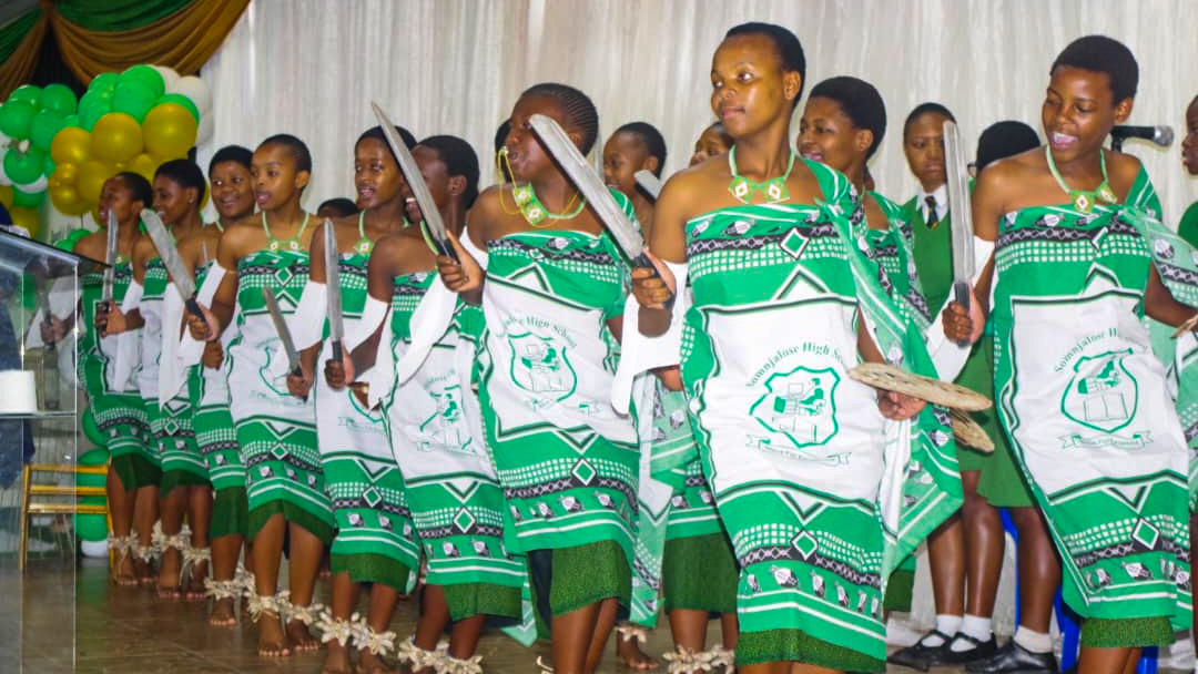 Pupils dancing to one of the country’s cultural song in their dazzling green lihiya. Beginning next year, the lihiya will form part of the school’s uniform, to be worn every Friday.